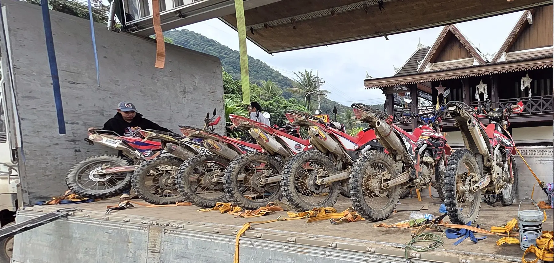 Honda dirt bikes secured for transport after an expedition