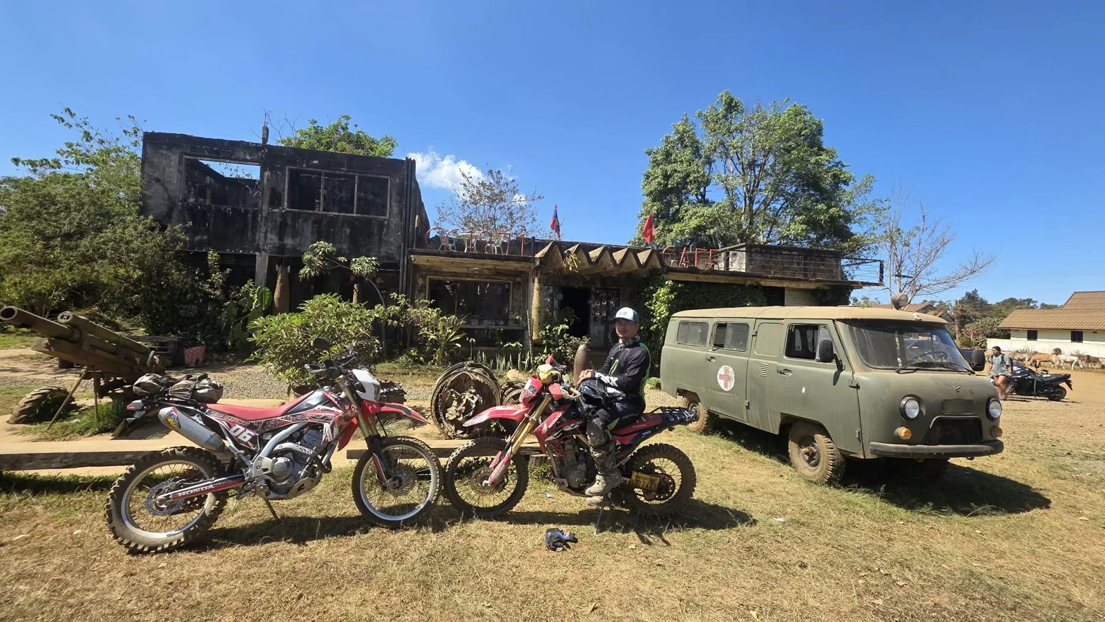Motorcycles alongside the support vehicle.