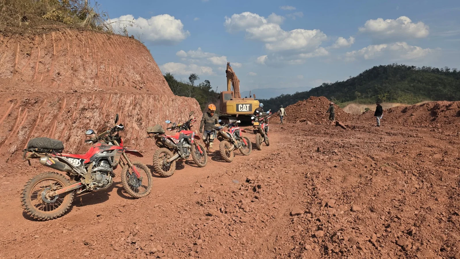 Riders passing a section of roadworks.
