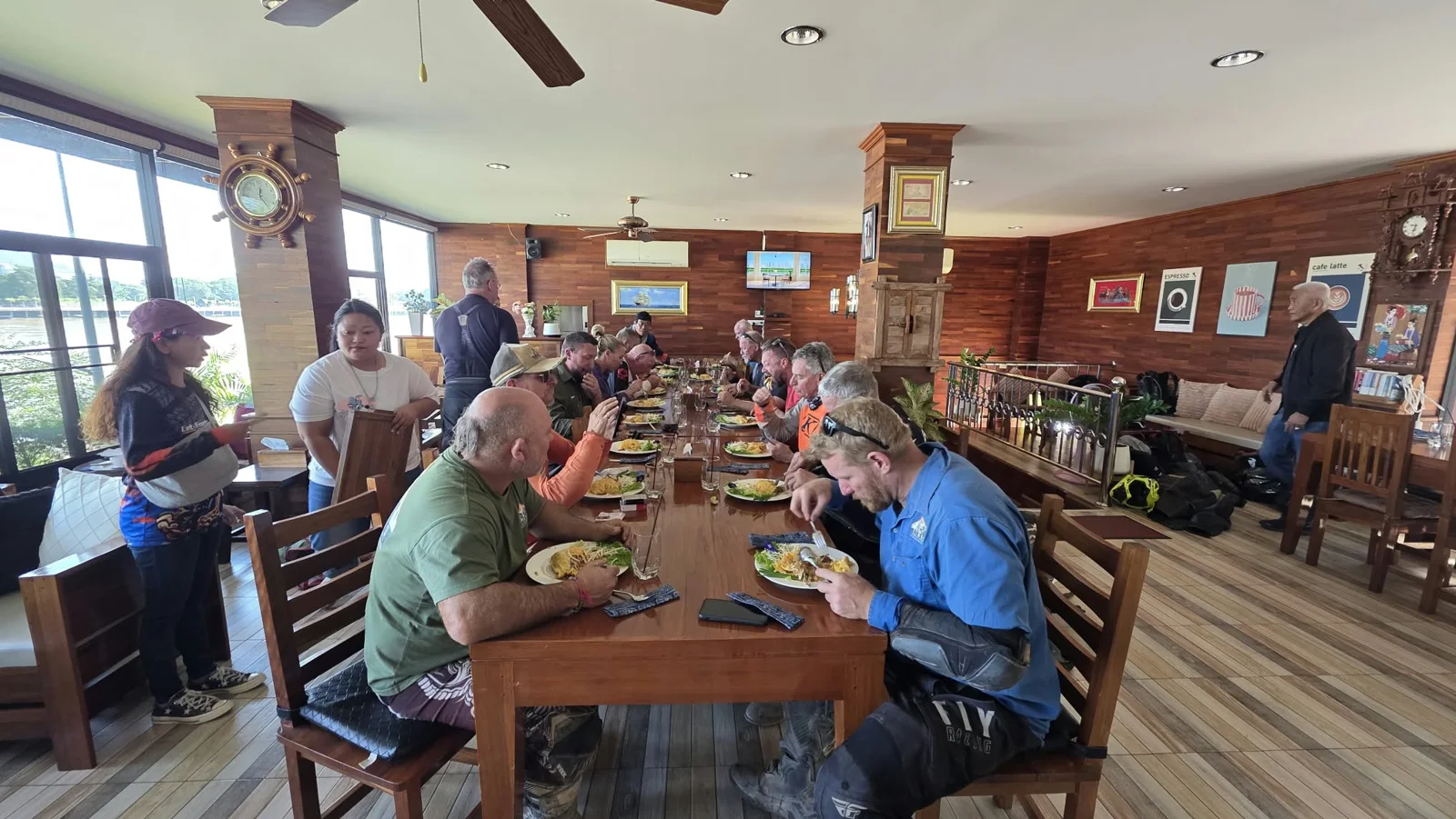 Riders gathering around the table.