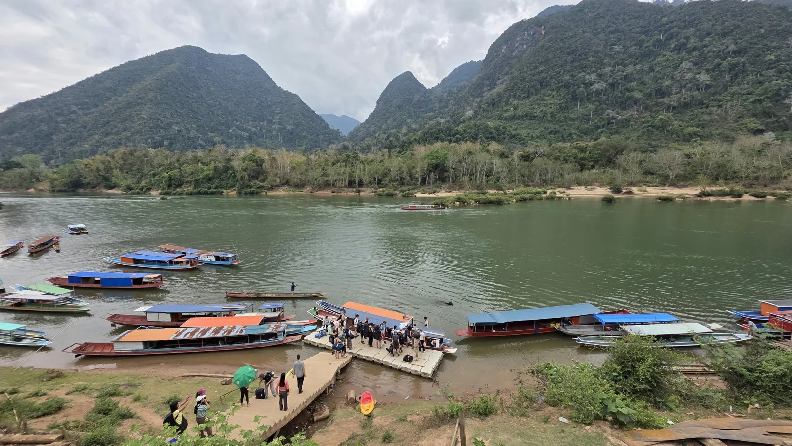 Longboats along a mountain river.