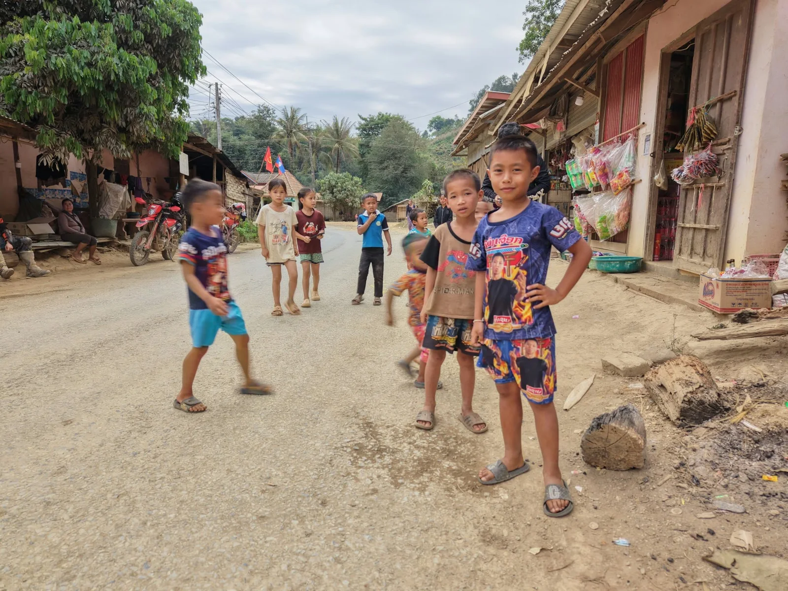 People along a village street.